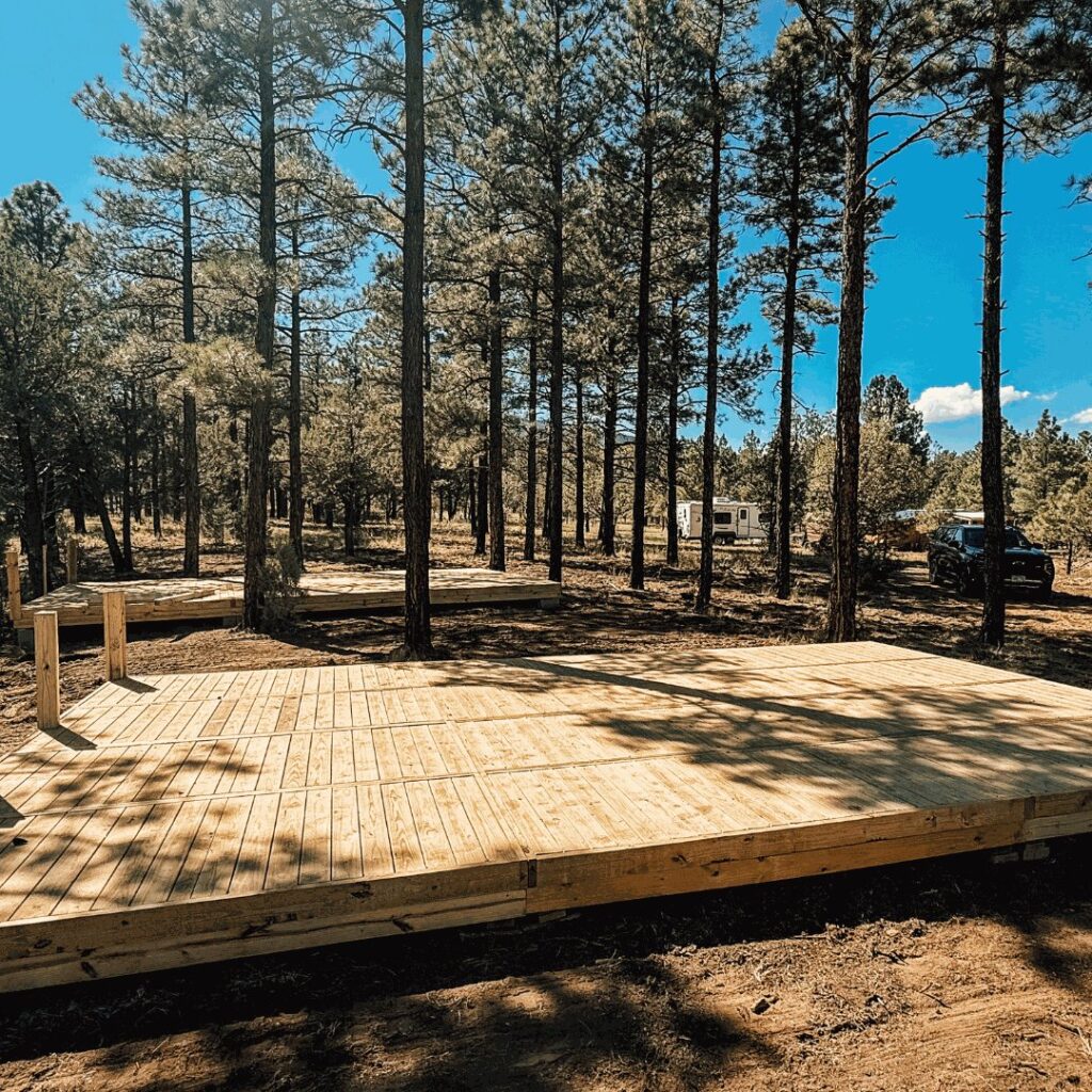 Wooden decks in the forest for use in an RV park.