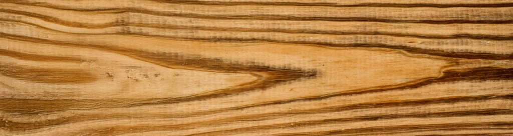 Pressure-treated southern pine decking boards — texture close-up.