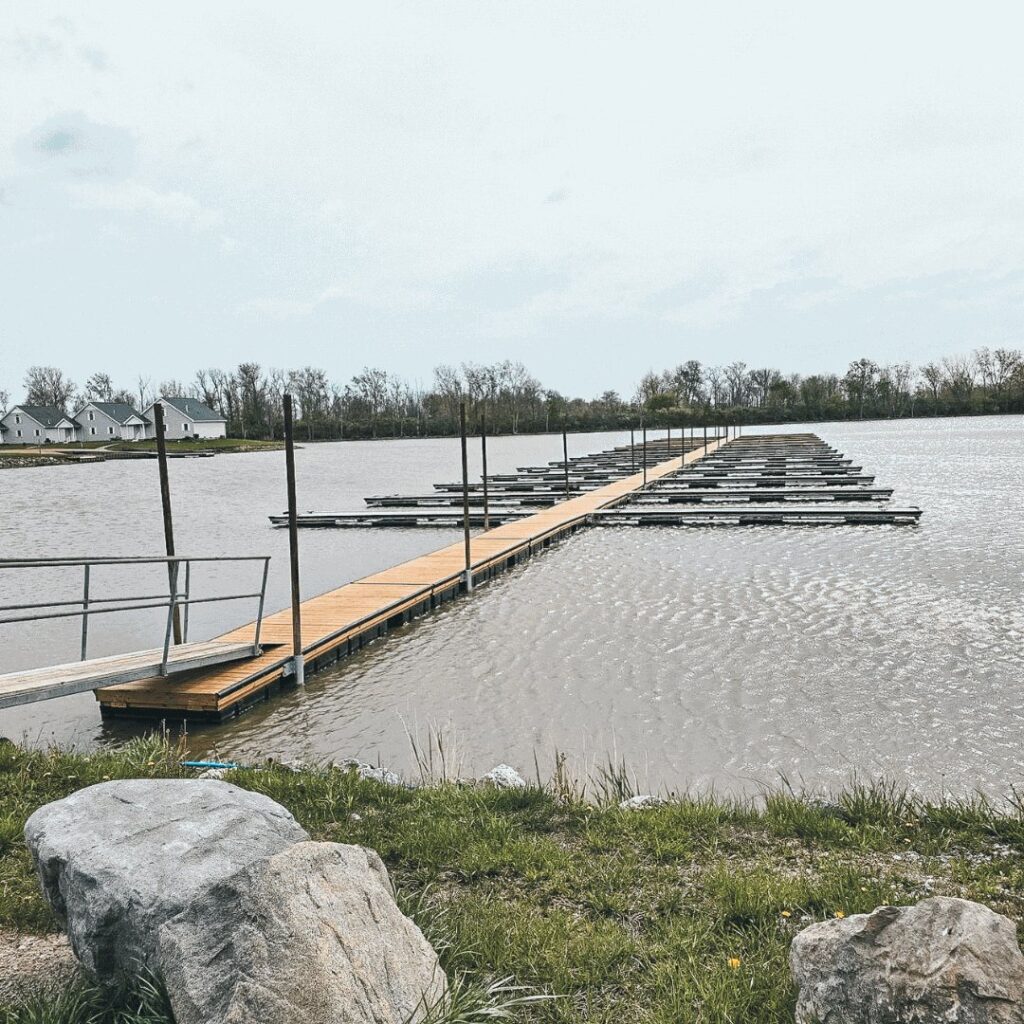 Wooden deck floating on water for use in marinas.