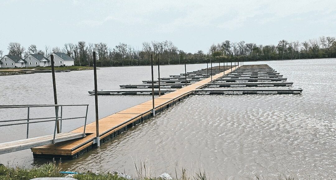 Wooden deck floating on water for use in marinas.