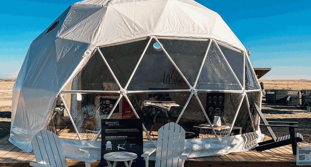 FDomes geodesic tent on a wooden deck by Flatspot Decking Services at the Glamping Show Americas.